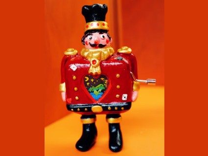 A decorative toy soldier with a crank