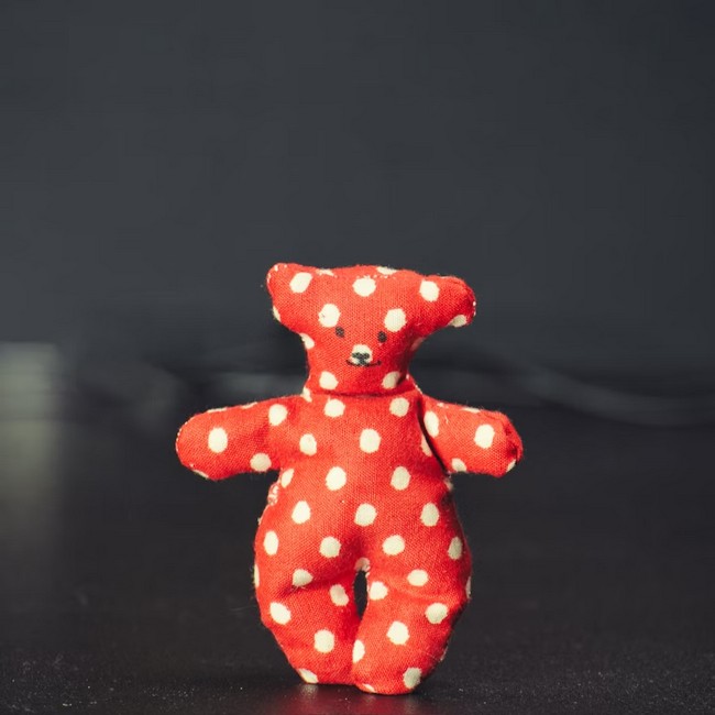 Red and white polka dot bear plush toy